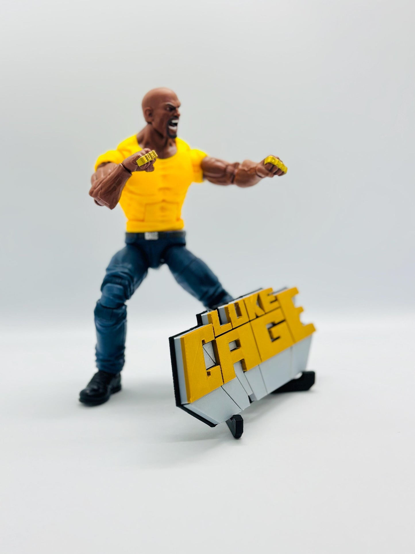 Luke Cage 3D +Magnetic Logo Display for Marvel Legends Action Figures, LEGO, Funko, Comics, and More.