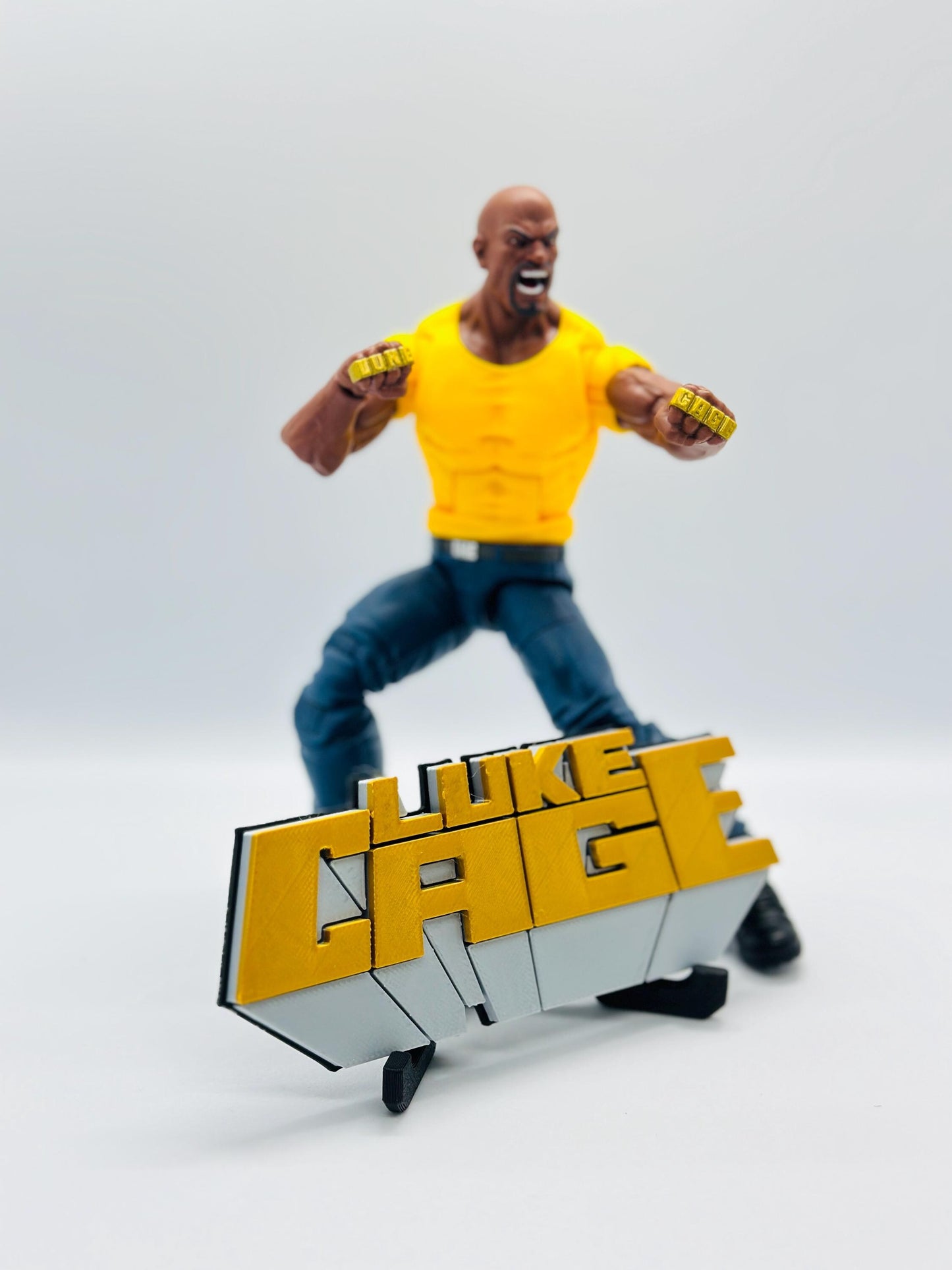 Luke Cage 3D +Magnetic Logo Display for Marvel Legends Action Figures, LEGO, Funko, Comics, and More.