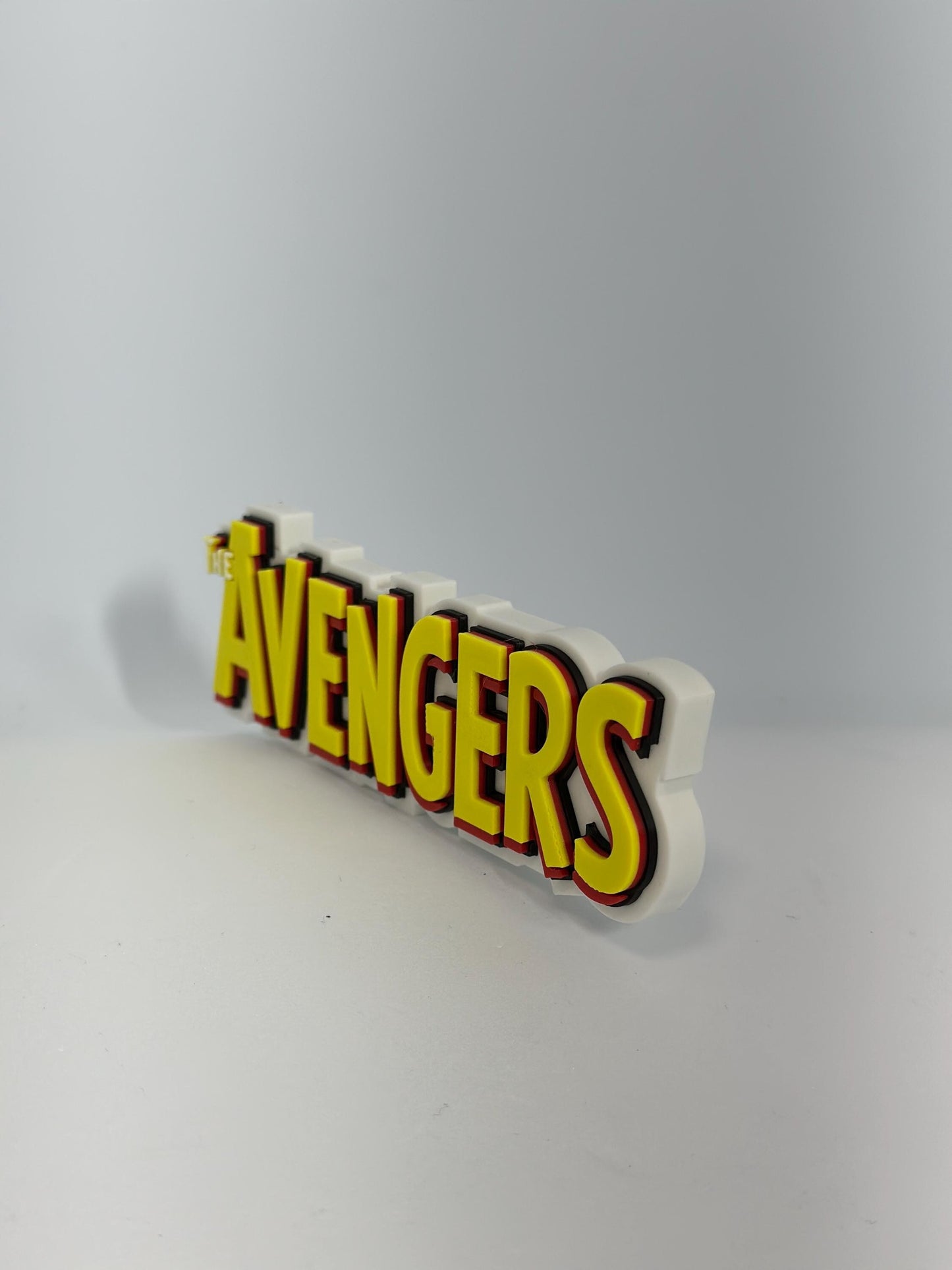 The Avengers classic Logo Display for Marvel Legends Action Figures, LEGO, Funko, Comics, and More.