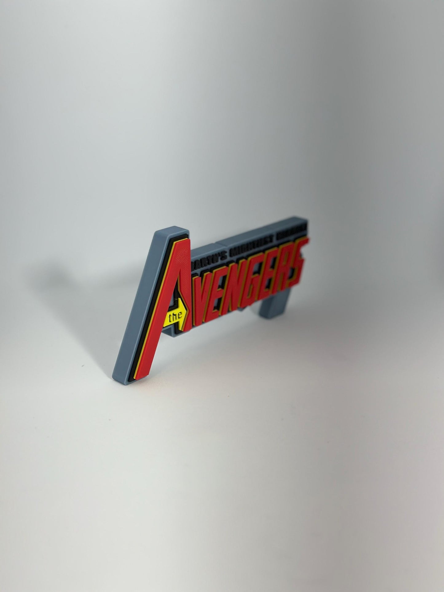 The Avengers Logo Display for Marvel Legends Action Figures, LEGO, Funko, Comics, and More.