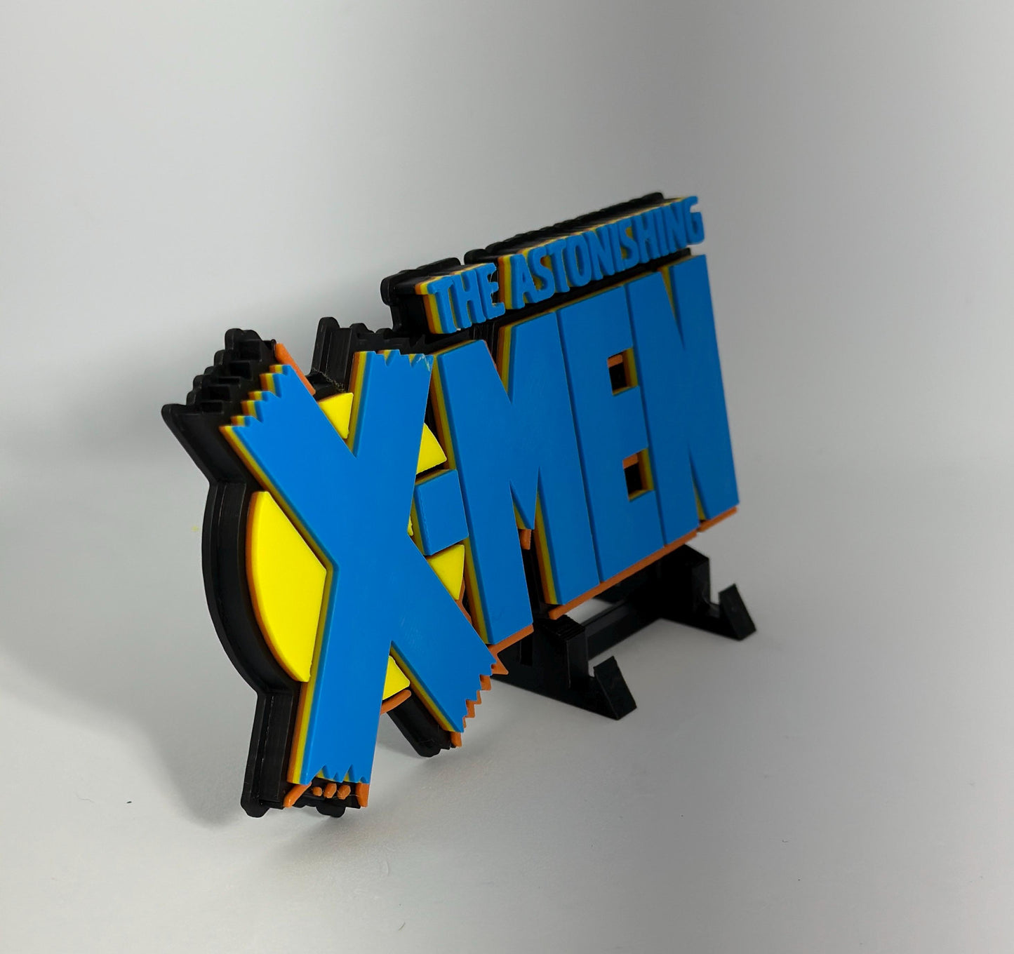 The astonishing XMEN 3D Logo Display for Marvel Legends Action Figures, LEGO, Comics, and More.